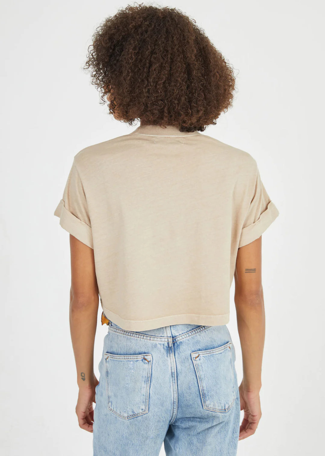 Upgrade your wardrobe with the Heart and Soul Crop Boyfriend Graphic Tee from Girl Dangerous. Made from 100% cotton, this premium sand-colored tee is pigment dyed for a vintage look. Featuring hand grinded edges and rolled sleeves, this oversized "boyfriend" style tee offers a soft and high quality feel. With a cropped fit, this tee is perfect for everyday wear. Model is wearing size small.