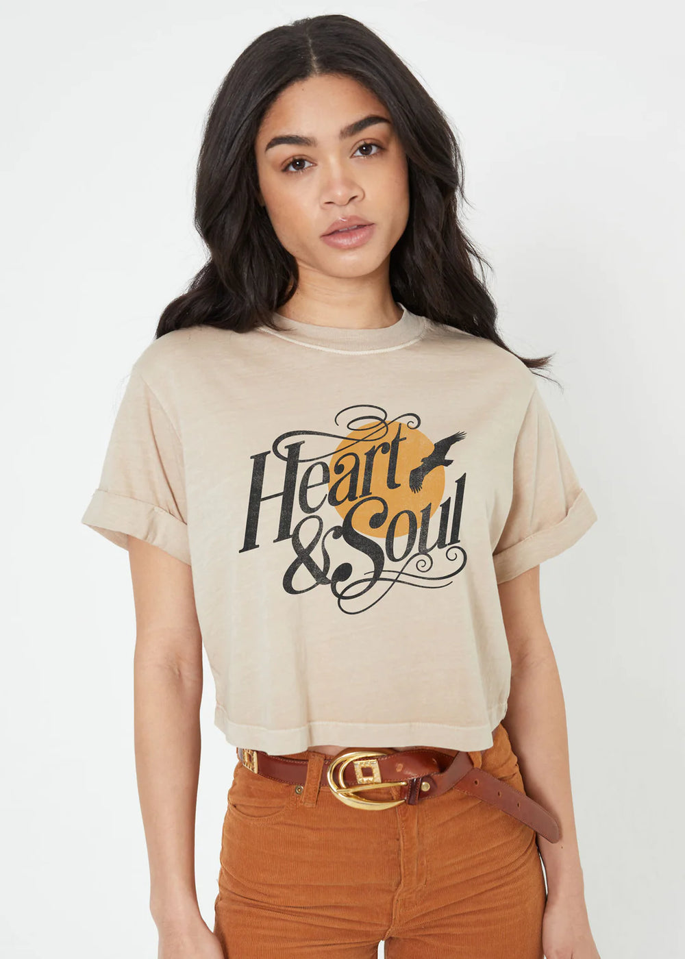 Upgrade your wardrobe with the Heart and Soul Crop Boyfriend Graphic Tee from Girl Dangerous. Made from 100% cotton, this premium sand-colored tee is pigment dyed for a vintage look. Featuring hand grinded edges and rolled sleeves, this oversized "boyfriend" style tee offers a soft and high quality feel. With a cropped fit, this tee is perfect for everyday wear. Model is wearing size small.